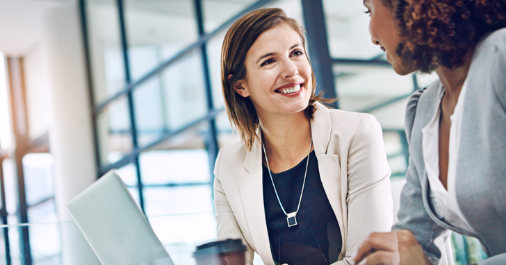 Two women consulting about finance