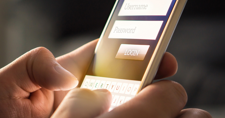 Fingers typing on a smartphone