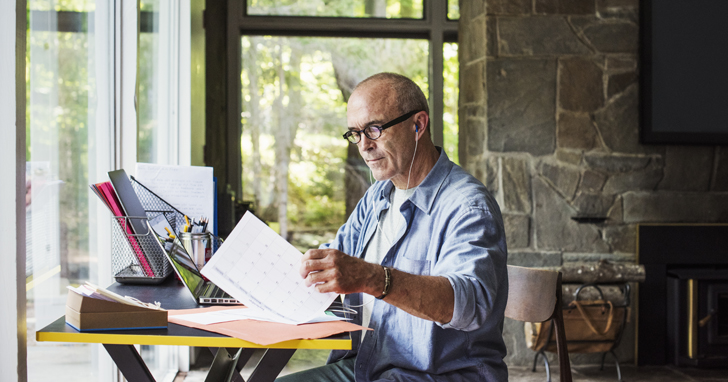Retired man at desk