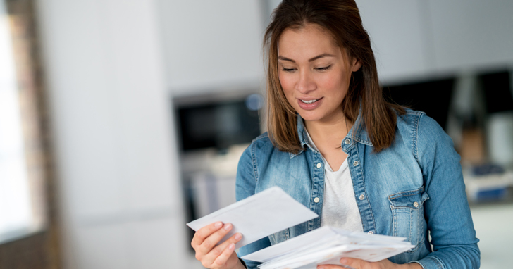 Woman opening mail