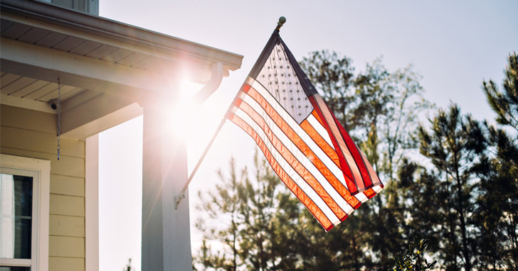 american flag on a house